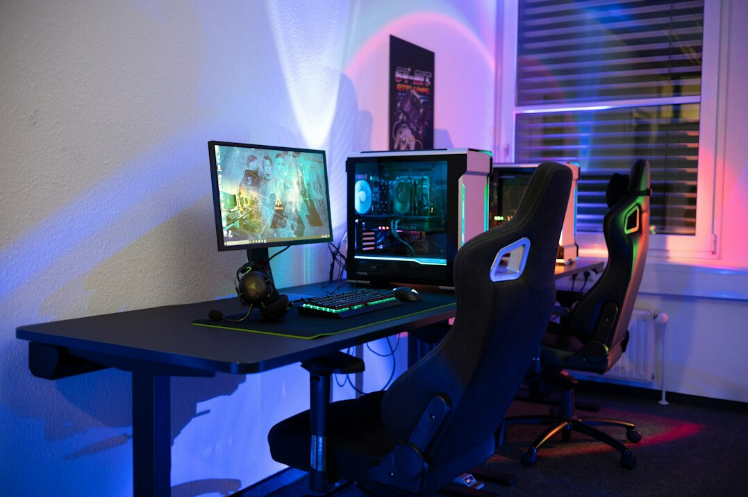 Dual monitor setup displaying charts and code