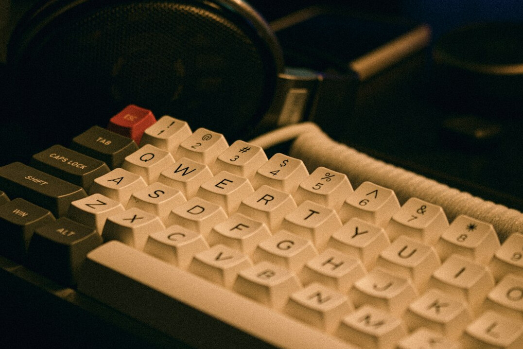 Close-up of hands typing on a mechanical keyboard