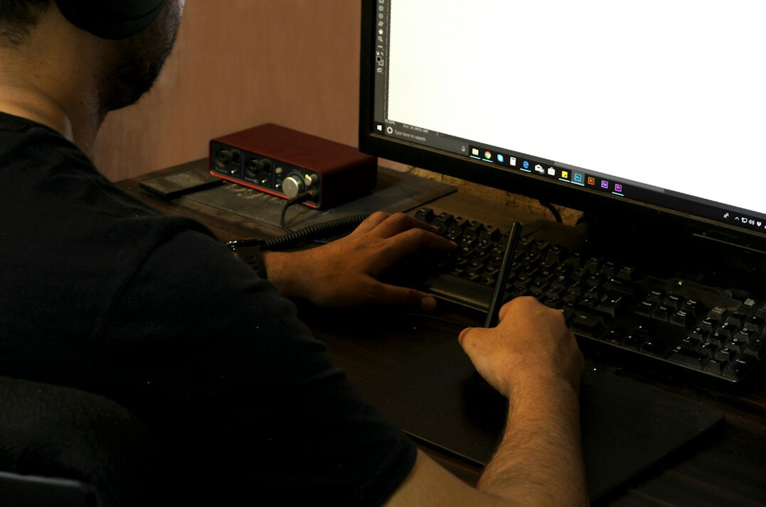 beginner programmer at desk