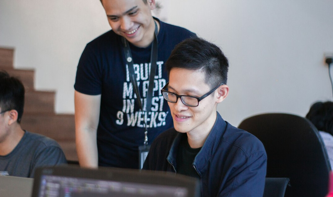 kids and adults coding together
